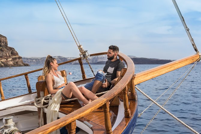 Santorini Volcano and Hot Springs Cruise Tour from Fira Old Port - What the guide can and cannot do