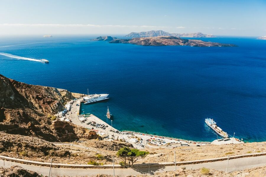 Santorini: Volcano and Hot Springs Sunset Dinner Cruise - Walking across Nea Kameni’s volcanic ground
