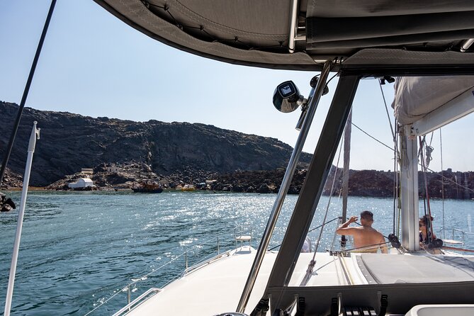 Semi Private Santorini Catamaran Tour - White Beach and the volcanic cliffs