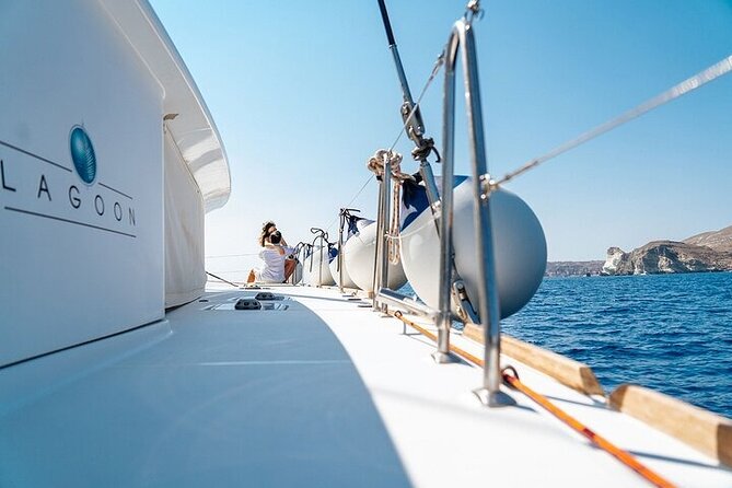 Semi Private Santorini Catamaran Tour - Red Beach, where the colors change fast