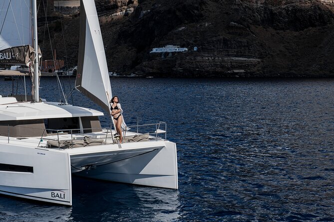 Shared Catamaran Half Day Cruise in Santorini - White Beach and the pale volcanic cliffs