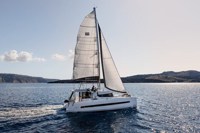 Shared Catamaran Half Day Cruise in Santorini - Red Beach from the water