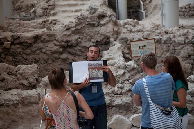 Small Group Santorini Discovery Tour with Lunch and Wine Tasting - Perissa Black Sand Beach and time to swim