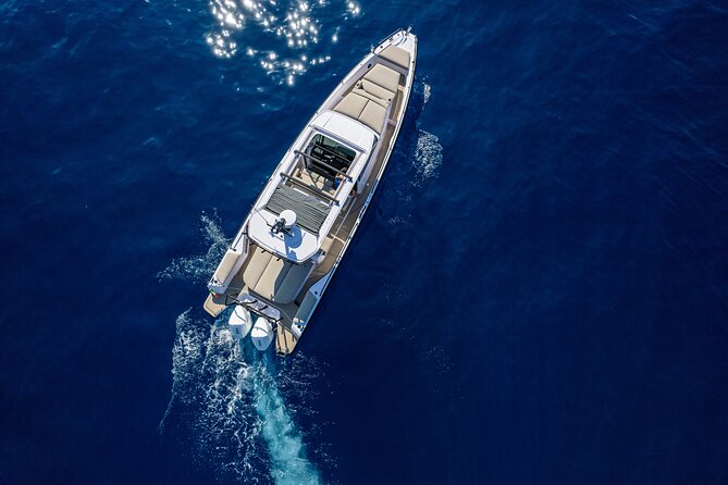 The Fastest Private Motor Yacht in Santorini - All Inclusive Tour - The lighthouse, lava rock, and volcanic coast